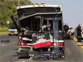 One dead, 13 injured in TTC bus crash